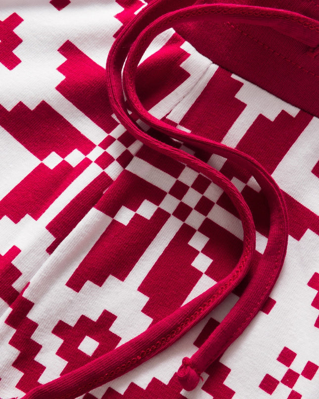 Punainen jouluneule perheen yövaatteet kodikkaille öille