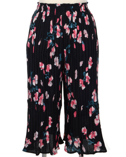 Mustat laskostetut housut