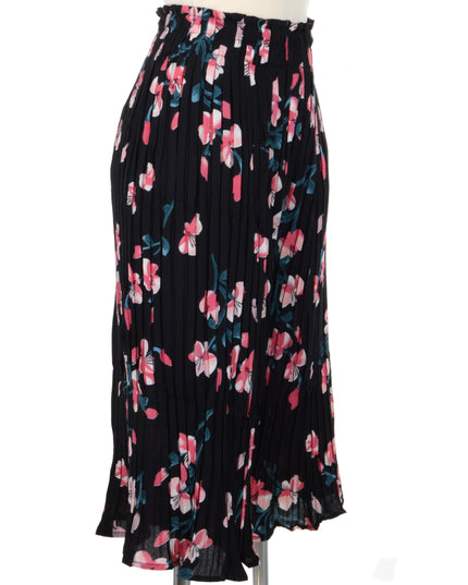 Mustat laskostetut housut